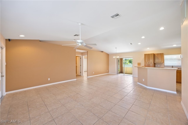 unfurnished living room with light tile patterned floors, vaulted ceiling, and ceiling fan