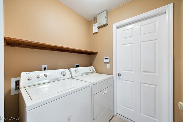 washroom with independent washer and dryer