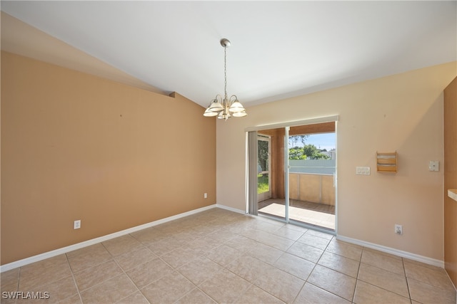 empty room featuring a chandelier, vaulted ceiling, and light tile patterned floors