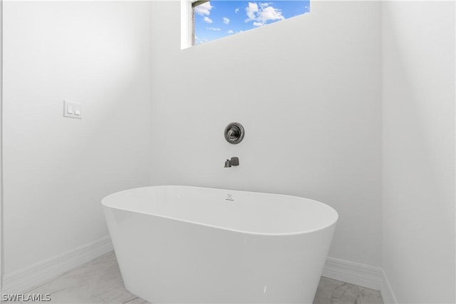 bathroom with a tub to relax in