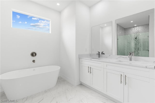 bathroom featuring vanity and shower with separate bathtub