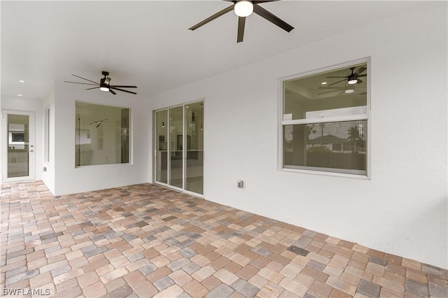 view of patio featuring ceiling fan