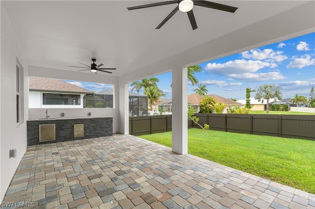 view of patio featuring exterior kitchen and sink