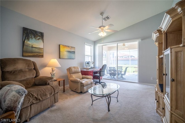 living room featuring ceiling fan, light colored carpet, and lofted ceiling