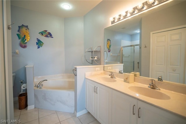 full bathroom with toilet, vanity, shower with separate bathtub, and tile patterned flooring