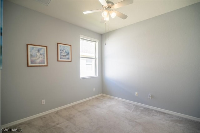 carpeted empty room with ceiling fan