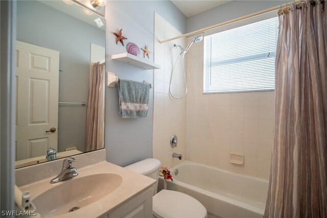 full bathroom with vanity, toilet, and shower / bathtub combination with curtain