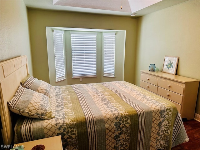 bedroom featuring dark wood-type flooring