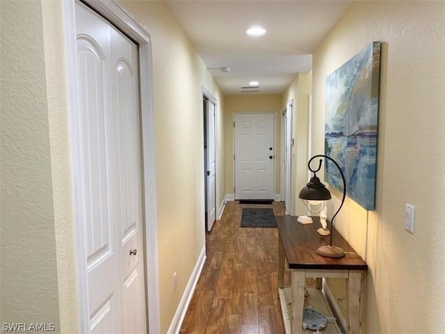 hallway featuring dark hardwood / wood-style floors