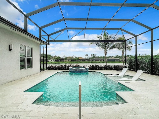 view of swimming pool featuring a lanai, an in ground hot tub, and a patio