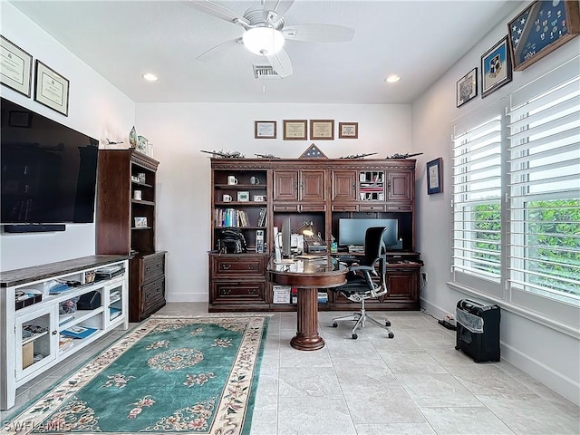 home office with ceiling fan and light tile patterned floors