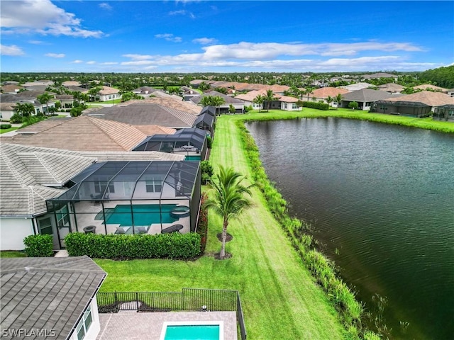 drone / aerial view with a residential view and a water view