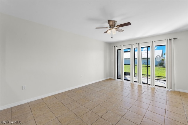 unfurnished room featuring light tile patterned flooring and ceiling fan