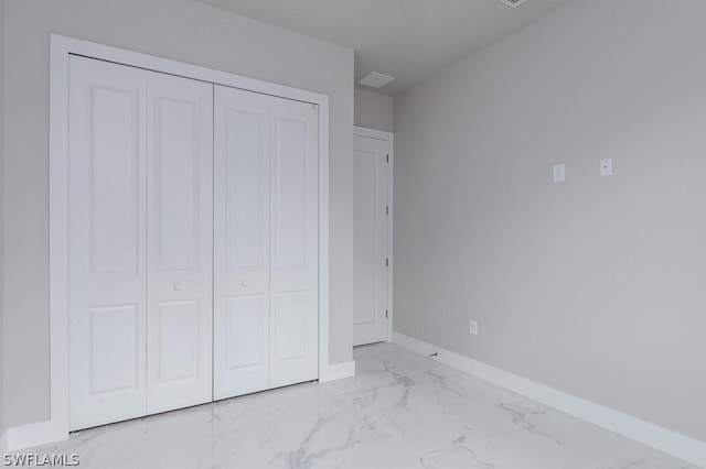 unfurnished bedroom featuring a closet