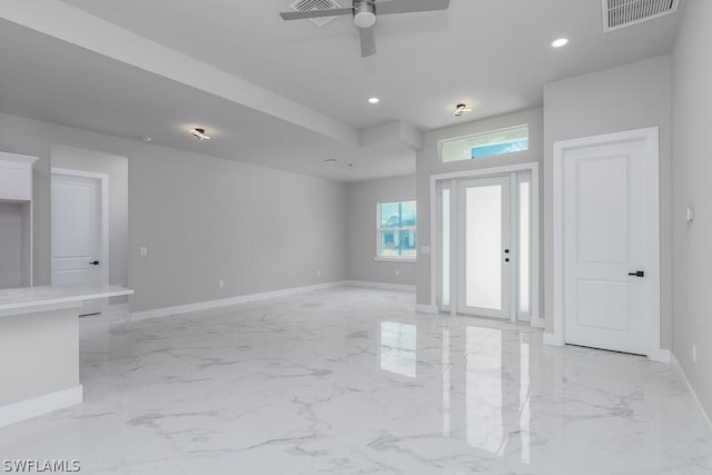 foyer entrance with ceiling fan