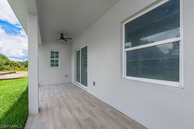 view of patio featuring ceiling fan