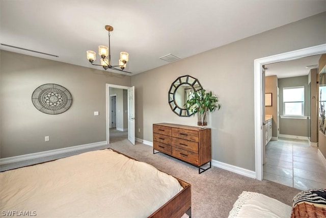 bedroom featuring connected bathroom, light colored carpet, and a notable chandelier