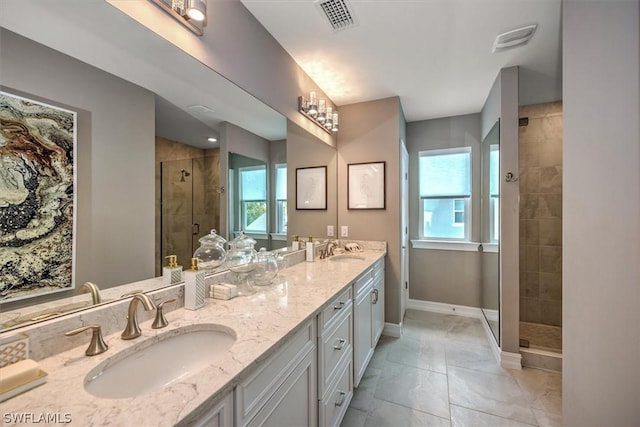 bathroom featuring vanity and a shower with shower door