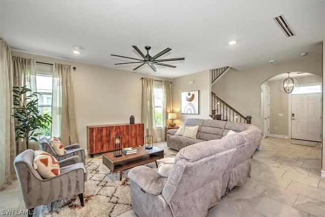 living room with ceiling fan and a wealth of natural light