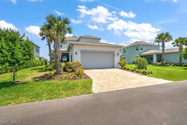 view of front of property with a front lawn and a garage