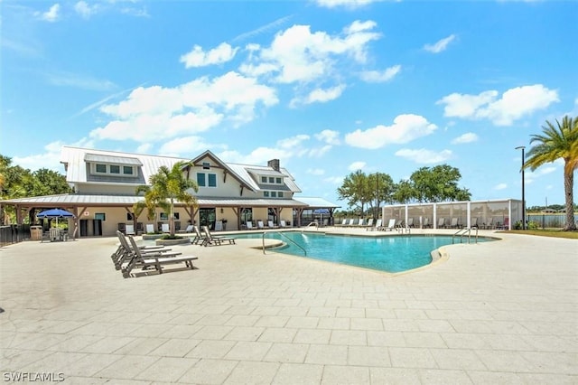 view of swimming pool with a patio area