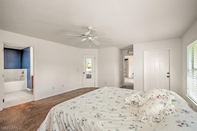 carpeted bedroom featuring ceiling fan and ensuite bathroom