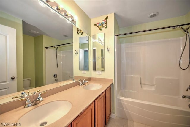 full bathroom with tile patterned flooring, vanity, bathing tub / shower combination, and toilet