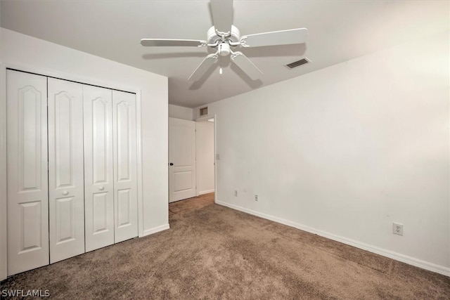 unfurnished bedroom featuring carpet flooring, a closet, and ceiling fan