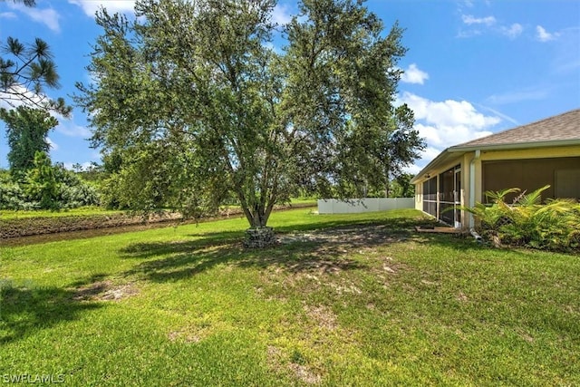 view of yard featuring a sunroom