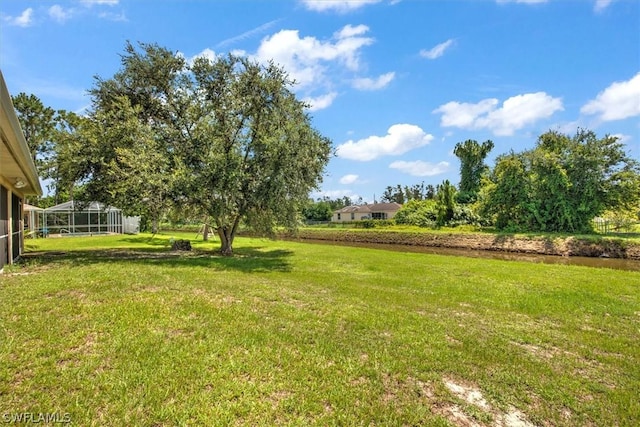 view of yard featuring a lanai