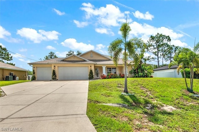 view of front of house with central AC unit, a garage, and a front yard