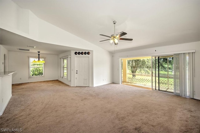 unfurnished living room featuring light colored carpet, ceiling fan, and lofted ceiling