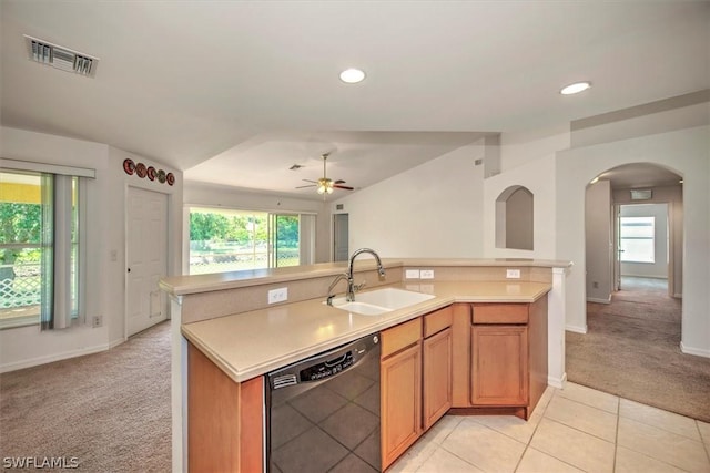 kitchen featuring dishwasher, light colored carpet, a center island with sink, and sink