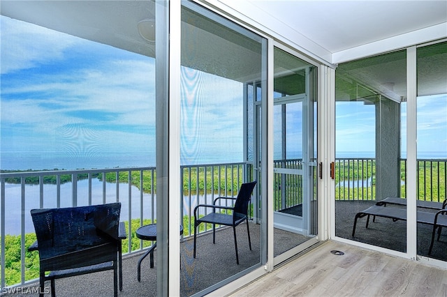 balcony featuring a water view