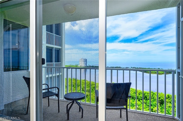 balcony featuring a water view