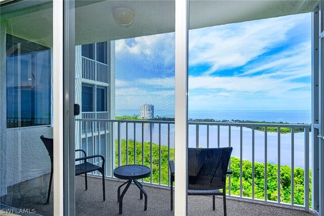 5550 Heron Point Dr Unit 1503, Naples, FL 34108 - balcony featuring a water view