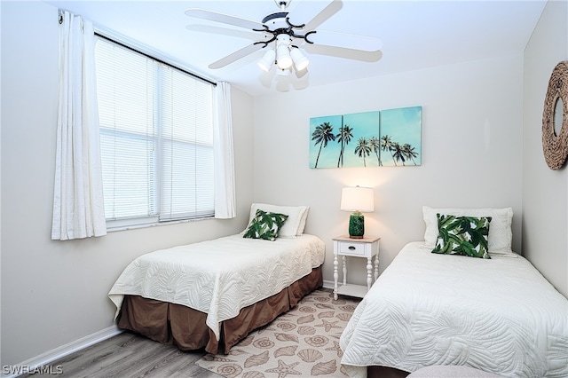 bedroom featuring ceiling fan and light hardwood / wood-style floors