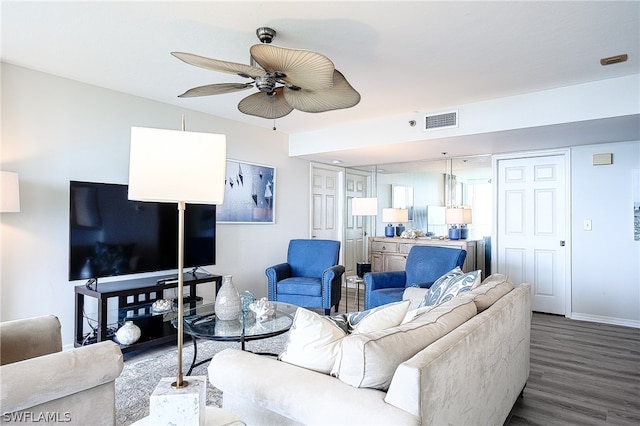 living room featuring ceiling fan and wood-type flooring