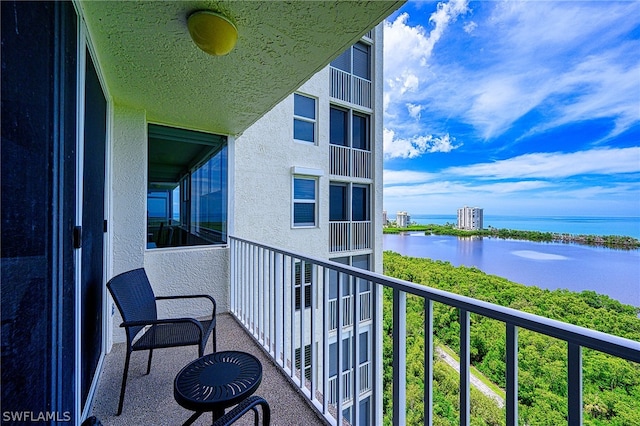 balcony featuring a water view