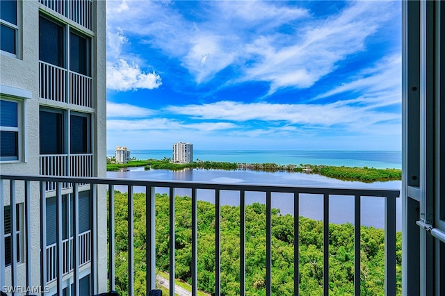 balcony featuring a water view