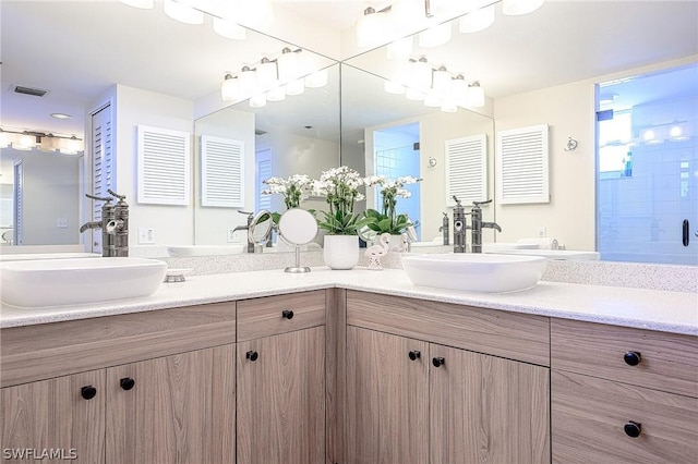5550 Heron Point Dr Unit 1503, Naples, FL 34108 - bathroom with double vanity and an enclosed shower