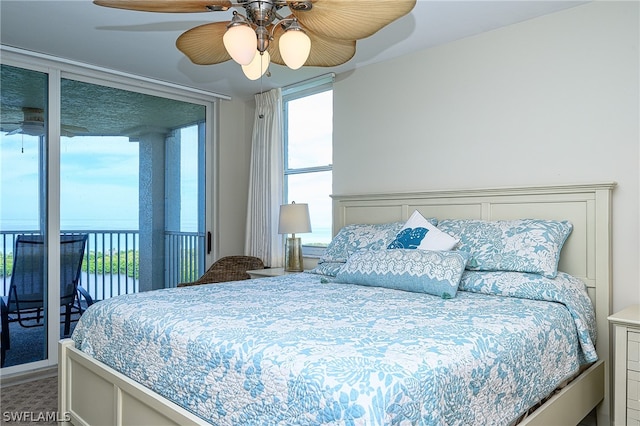 bedroom with carpet flooring, multiple windows, and ceiling fan