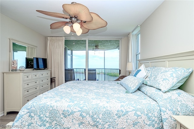 bedroom with hardwood / wood-style floors, ceiling fan, and access to exterior