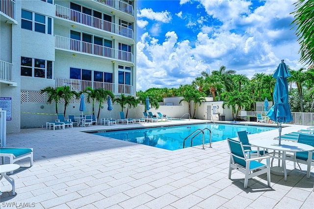 5550 Heron Point Dr Unit 1503, Naples, FL 34108 - community pool with a patio