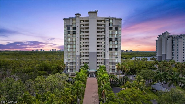 view of outdoor building at dusk