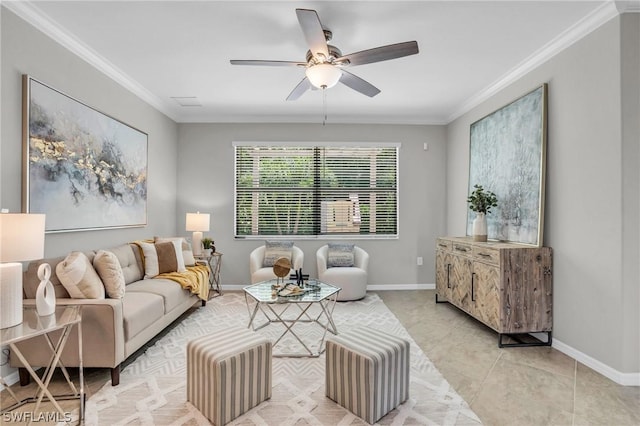 living area with light tile patterned floors, ceiling fan, baseboards, and crown molding