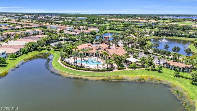 drone / aerial view featuring a water view and a residential view