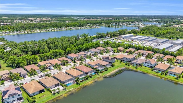 bird's eye view with a residential view and a water view