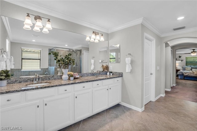 full bath with a sink, visible vents, and crown molding