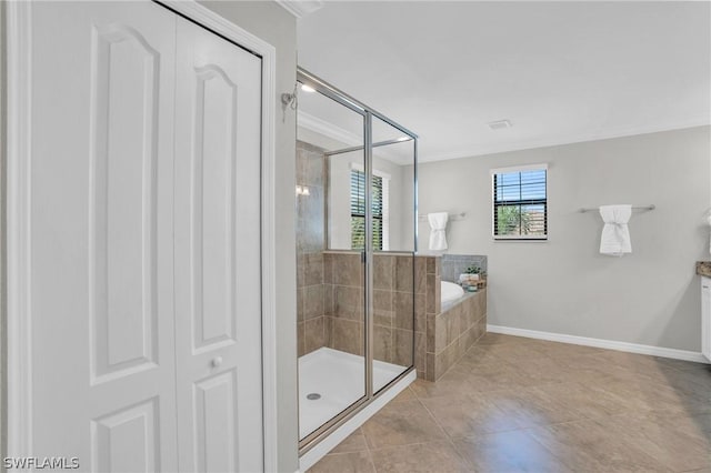 full bath featuring a garden tub, crown molding, a shower stall, baseboards, and tile patterned floors